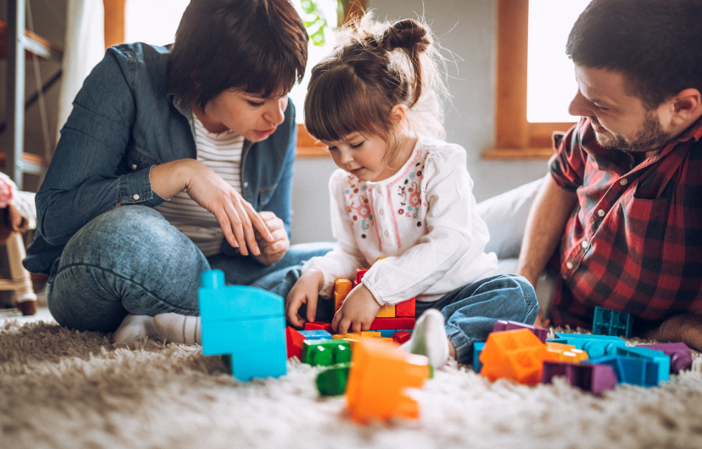 Parents supporting their child after an Applied Behavior Analysis (ABA) therapy session