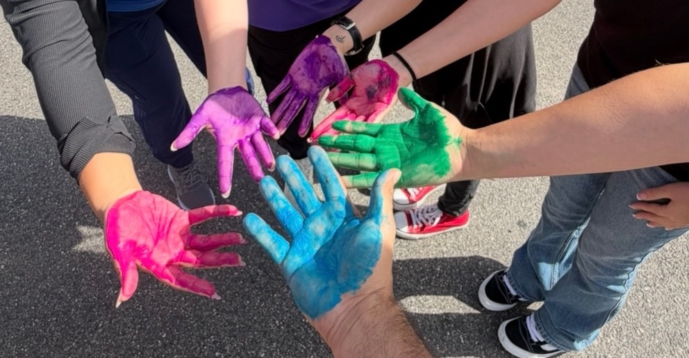 Six palms opened and painted with different colors